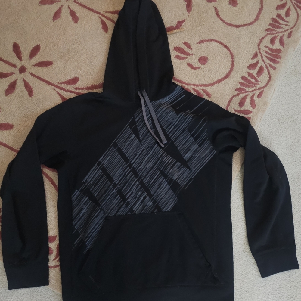 Nike Therma-Fit pullover featuring a large diagonal "NIKE" spell-out logo